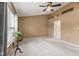 Bright bedroom featuring neutral walls, a ceiling fan, and large window at 4907 Franklin Villas Pl, Indianapolis, IN 46237