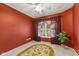 Bright bedroom features a ceiling fan, a window with curtains, and a decorative rug at 4907 Franklin Villas Pl, Indianapolis, IN 46237