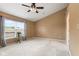 Bedroom featuring neutral walls, a ceiling fan, and large window at 4907 Franklin Villas Pl, Indianapolis, IN 46237