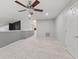 Expansive bonus room with ceiling fan, neutral walls and floors and lots of light at 4907 Franklin Villas Pl, Indianapolis, IN 46237