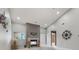 Cozy living room with fireplace and large mirror, offering ample natural light at 4907 Franklin Villas Pl, Indianapolis, IN 46237