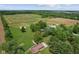 Aerial view of a home surrounded by trees, fields, and greenery at 522 E County Road 1000 S, Clayton, IN 46118