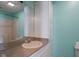 Bathroom with a large mirror over a vanity with taupe countertop and white cabinet at 522 E County Road 1000 S, Clayton, IN 46118