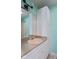 Bathroom with white vanity, taupe countertop, large mirror, and cabinet storage at 522 E County Road 1000 S, Clayton, IN 46118
