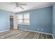 Bedroom with a large window and closet with shelving provides ample storage space at 522 E County Road 1000 S, Clayton, IN 46118