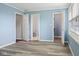Bedroom with multiple doorways and a large window showcases abundant lighting at 522 E County Road 1000 S, Clayton, IN 46118