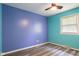 An accent wall with unique paint choices creates a bright bedroom space at 522 E County Road 1000 S, Clayton, IN 46118