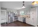 Well-equipped kitchen with stainless steel appliances, modern cabinets, and tile backsplash at 522 E County Road 1000 S, Clayton, IN 46118