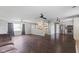 Open-concept living room with view of the kitchen, modern flooring, and lots of light at 522 E County Road 1000 S, Clayton, IN 46118