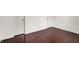 This basement features hardwood floors and a set of doors at 5305 Adrian Orchard Dr, Indianapolis, IN 46217