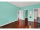 This bedroom features a light blue color scheme and beautiful hardwood floors at 5305 Adrian Orchard Dr, Indianapolis, IN 46217