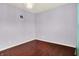 Empty bedroom featuring hardwood floors, fresh paint, and natural light at 5305 Adrian Orchard Dr, Indianapolis, IN 46217