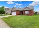 Beautiful single-story brick home featuring a lush green lawn at 5305 Adrian Orchard Dr, Indianapolis, IN 46217