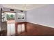 Bright living room features hardwood floors, large window and sliding glass door at 5305 Adrian Orchard Dr, Indianapolis, IN 46217