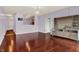 Open-concept living room with hardwood floors, recessed lighting, and modern chandelier at 5305 Adrian Orchard Dr, Indianapolis, IN 46217