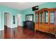 Spacious main bedroom with beautiful floors, lots of closet space, and mounted television at 5305 Adrian Orchard Dr, Indianapolis, IN 46217