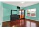 Spacious main bedroom with hardwood floors and a large window at 5305 Adrian Orchard Dr, Indianapolis, IN 46217