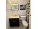 Cozy bathroom featuring tile floors, black and white design elements, and a classic vanity at 539 Willow Dr, Danville, IN 46122