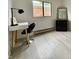 Cozy bedroom featuring wood floors, a modern desk, and a large window at 539 Willow Dr, Danville, IN 46122