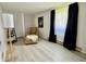 Bright bedroom featuring wood floors, chair and lots of natural light at 539 Willow Dr, Danville, IN 46122
