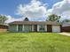 Charming one-story home featuring a lush green lawn, attached garage, and a welcoming entrance at 539 Willow Dr, Danville, IN 46122