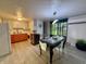 Eat-in kitchen featuring new wood flooring, a dining table and an abundance of natural light at 539 Willow Dr, Danville, IN 46122