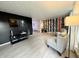 Bright living room showcasing wood floors, accent wall, and lots of natural light at 539 Willow Dr, Danville, IN 46122