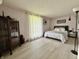 Spacious bedroom featuring wood floors, a large window, and a serene atmosphere at 539 Willow Dr, Danville, IN 46122