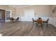 A dining area features tables with brown chairs and is nicely illuminated with natural light at 5533 Tart Blvd, Indianapolis, IN 46239