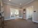 The stylish entrance showcases a modern design with glass doors and a glimpse of the living area at 5533 Tart Blvd, Indianapolis, IN 46239