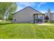 Large, well-maintained backyard with lush green grass and a patio at 5554 Jona Way, Bargersville, IN 46106