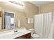 Bathroom features single vanity, modern lighting, tile flooring and shower with curtain at 5554 Jona Way, Bargersville, IN 46106
