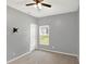 Neutral bedroom with carpet flooring features ceiling fan and large window at 5554 Jona Way, Bargersville, IN 46106