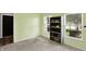 Spare bedroom with green walls features carpet flooring, large window and a closet at 5554 Jona Way, Bargersville, IN 46106