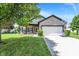 Charming single-Gathering home with a well-manicured lawn, two-car garage, and a cozy front porch at 5554 Jona Way, Bargersville, IN 46106