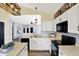 Bright kitchen features white cabinets, modern appliances, and flows into adjacent living space at 5554 Jona Way, Bargersville, IN 46106