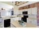 Spacious kitchen featuring white cabinets, black appliances, and hardwood flooring at 5554 Jona Way, Bargersville, IN 46106