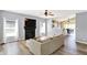 Cozy living room featuring a fireplace, hardwood floors, and seamlessly connecting to the kitchen at 5554 Jona Way, Bargersville, IN 46106
