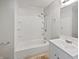 Clean bathroom with white vanity, shower-tub combo, and modern fixtures at 616 W Michigan St, Greenfield, IN 46140