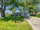 Charming single-story home with well-maintained lawn, mature trees, and inviting curb appeal at 616 W Michigan St, Greenfield, IN 46140