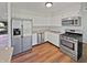 Kitchen featuring stainless steel appliances, white cabinets, and modern countertops at 616 W Michigan St, Greenfield, IN 46140