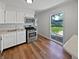 Bright kitchen features new stainless steel appliances and wood flooring at 616 W Michigan St, Greenfield, IN 46140