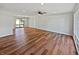 Spacious living area with hardwood flooring, ceiling fan, and natural light at 616 W Michigan St, Greenfield, IN 46140