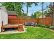 The backyard features a hot tub, outdoor seating, and a wooden fence at 6176 Kingsley Dr, Indianapolis, IN 46220