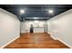 Finished basement with sleek kitchenette, including a mini-fridge and sink at 6176 Kingsley Dr, Indianapolis, IN 46220