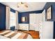 Tastefully styled blue bedroom with a large window and classic decor at 6176 Kingsley Dr, Indianapolis, IN 46220