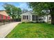 Charming home featuring a screened porch, stone accents, and a well-maintained lawn and driveway at 6176 Kingsley Dr, Indianapolis, IN 46220