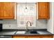 Close up of a kitchen sink and window with traditional faucet at 6176 Kingsley Dr, Indianapolis, IN 46220