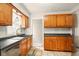 Functional kitchen features wooden cabinets, modern appliances, and ample counter space at 6176 Kingsley Dr, Indianapolis, IN 46220
