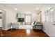 Comfortable living room featuring a large window and a cozy sofa and chair at 6176 Kingsley Dr, Indianapolis, IN 46220